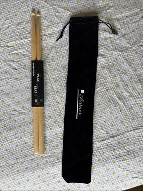 Black Velvet Drumstick Bag with Natural Wood Drumsticks